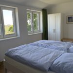 Ferienwohnung Seeblick Schlafzimmer - Ferienhaus Emma-Arngast
